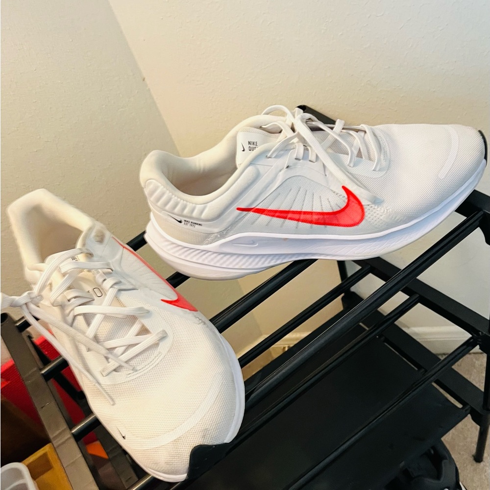 White Nike athletic Shoes with orange swoosh wore them for about a month